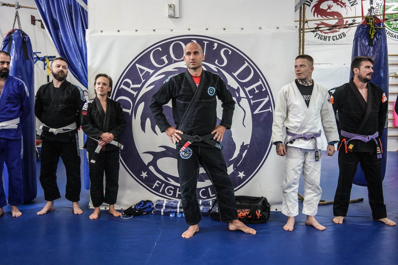 BJJ team standing and explaining training program